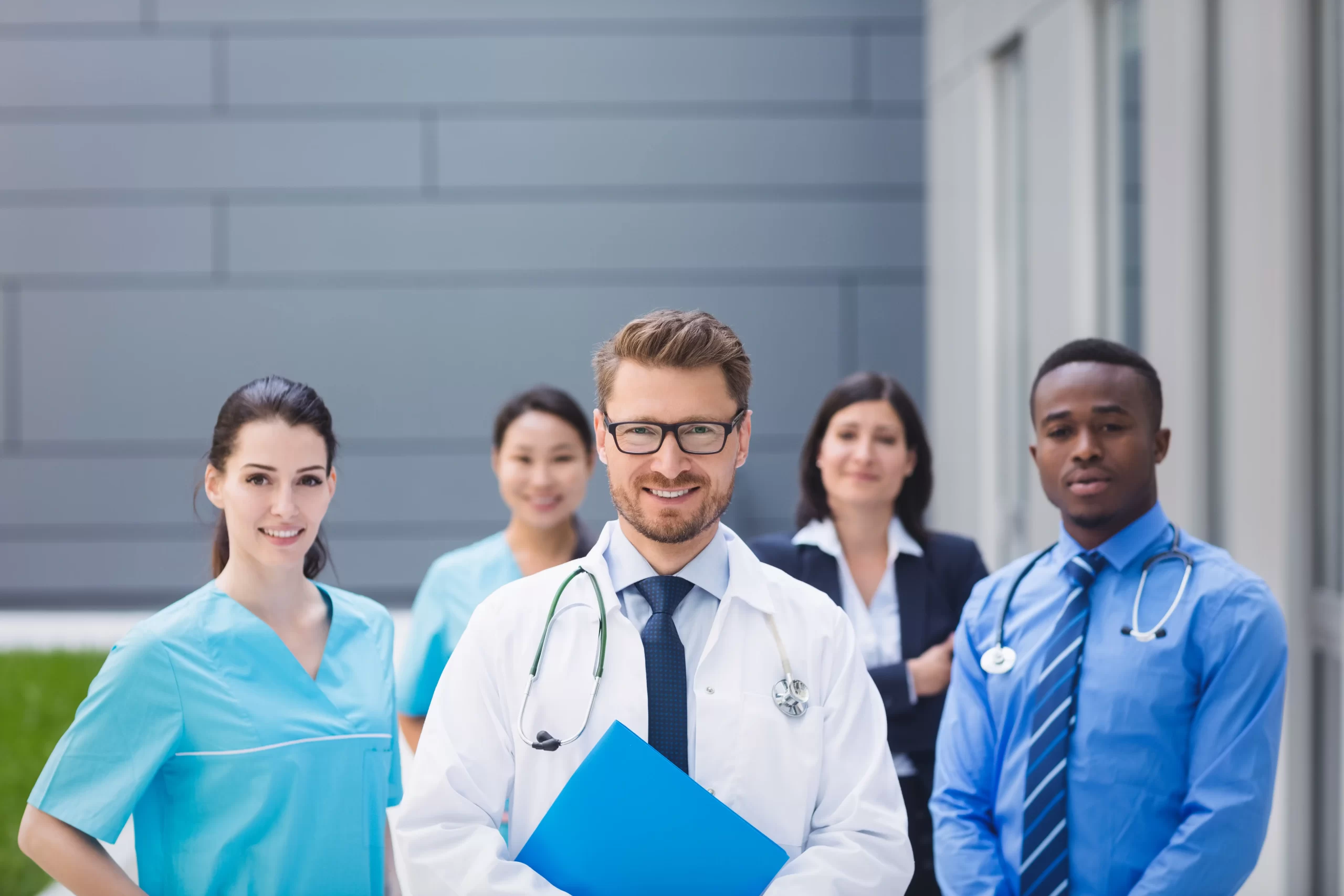 team doctors standing together hospital premises scaled 1