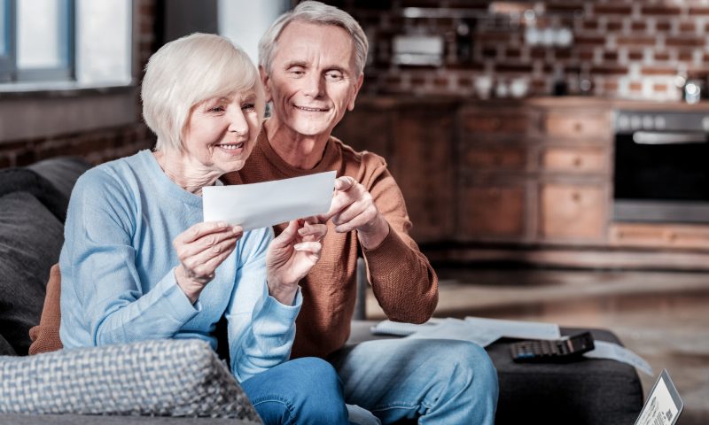 Delighted senior people being happy together social security